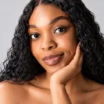 Beautiful woman with radiant, smooth skin representing the benefits of microneedling vs chemical peel treatments at Magnolia Medical & Aesthetics in San Antonio, TX.